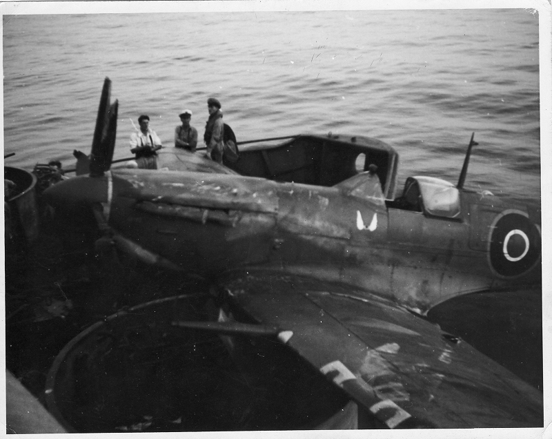 Sporting invasion stripes Hellcat JV125 ‘E-N’ of 800 NAS ranged on JHMS Emperor’s flight deck preparing for take off during operation “Dragoon”, August 1944.