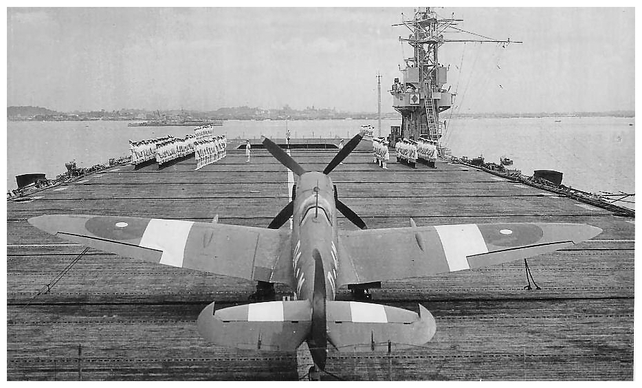 Sporting invasion stripes Hellcat JV125 ‘E-N’ of 800 NAS ranged on JHMS Emperor’s flight deck preparing for take off during operation “Dragoon”, August 1944.