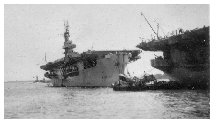 HMS Patroller moored behind HMS Queen in Colombo harbour March 31st 1946; Queen is embarking surplus airframes for disposal at sea while Patroller is loading stores and passengers ready for the next leg of her trooping voyage.  Photo: courtesy of Mrs. Kay Morgan, Thanks to David Weaver for photo interpretation.