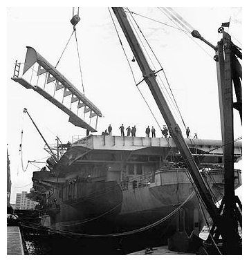 HMS Ranee has her round-down removed ready for the lengthening of her flight deck in Burrards dockyard, Vancouver. Photo: Ronny Jaques / National Film Board of Canada. PhotothÃƒÂ¨que / Library and Archives Canada