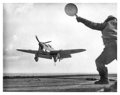 A Firefly is guided onto the deck by the Deck Landing Control Officer during a DLT period.  Photo: Courtesy of Terry Oxley
